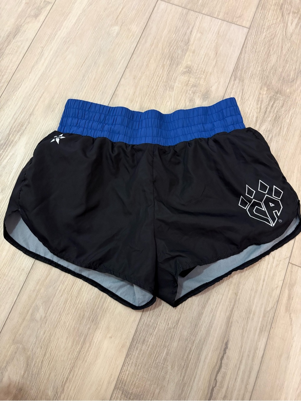 Black Rebel Athletic Cheer Athletics shorts with a blue waistband